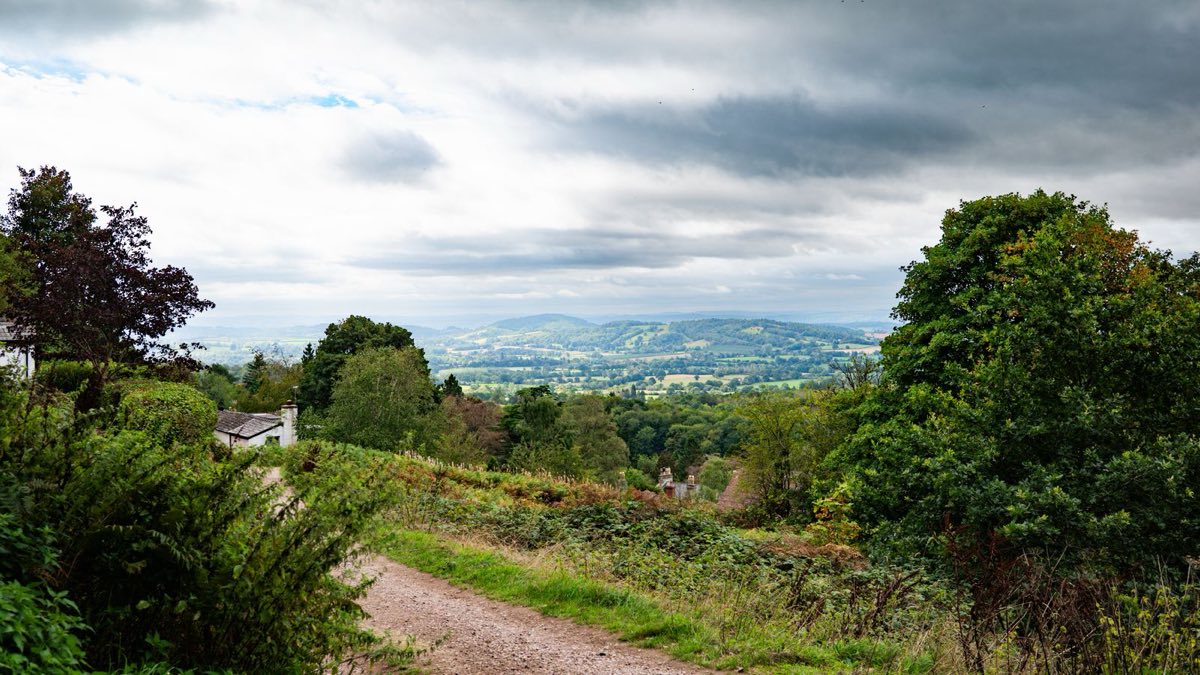 A track on the Malvern Hills looking out over wooded slopes near Great Malvern